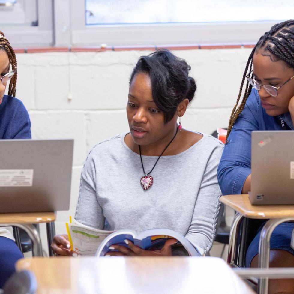 Three female math teachers collaborate