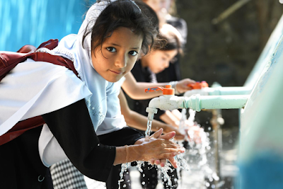 Girl washing hands