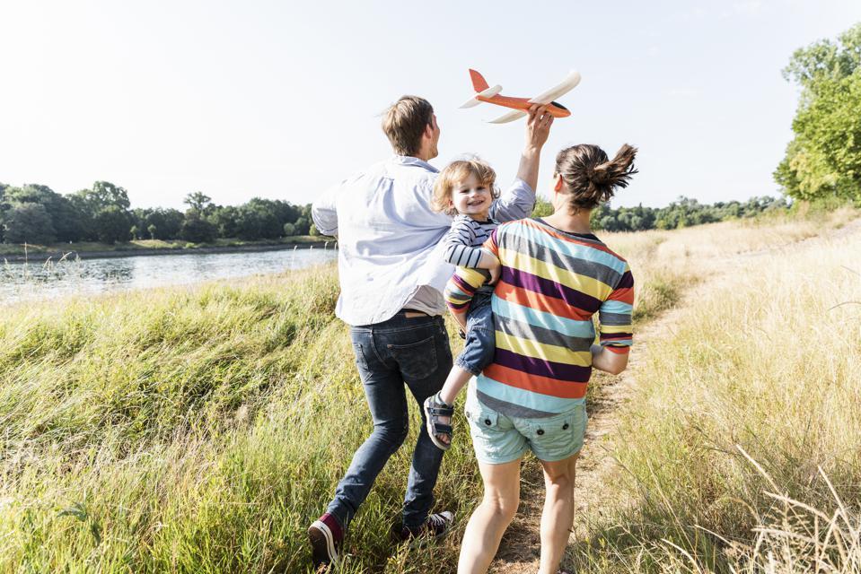 Family running in a field.