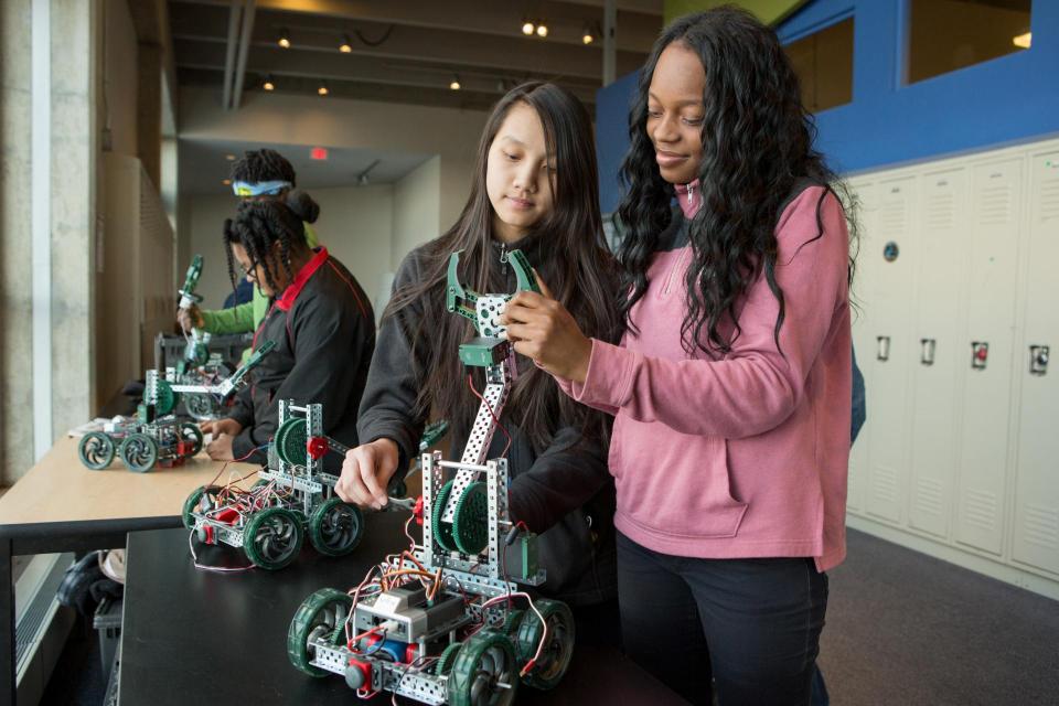 Two girls participating in a robotics experiment