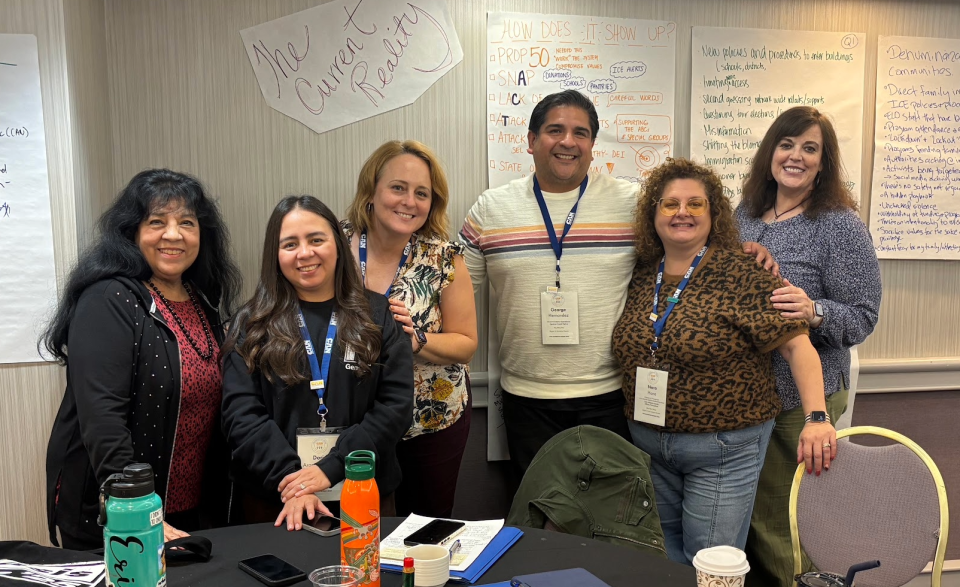 CAN Leadership Team at the 2025 Fall Meeting in Long Beach, CA. members of the CAN Leadership team posing for a photo around a table in a meeting room