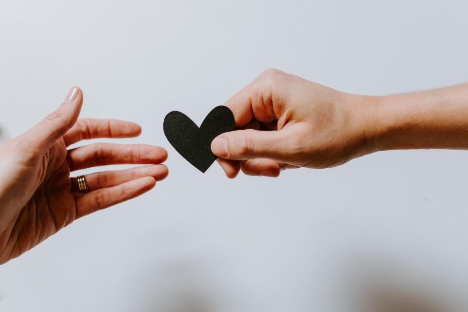 Human hands holding a heart 