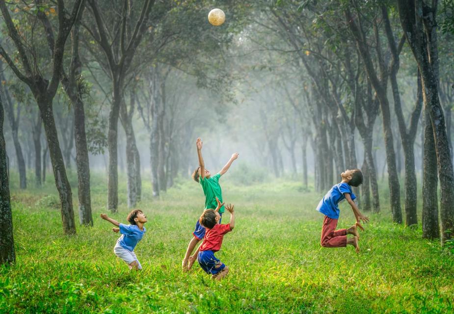 Field with children playing ball