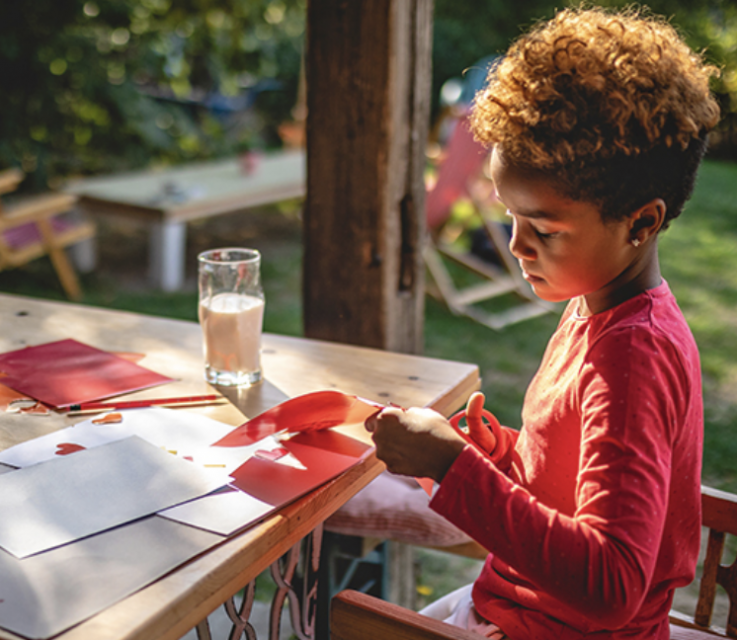 Child painting outdoors