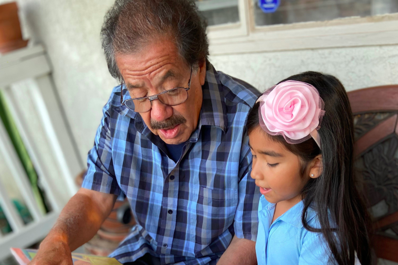 Elder reading to a child