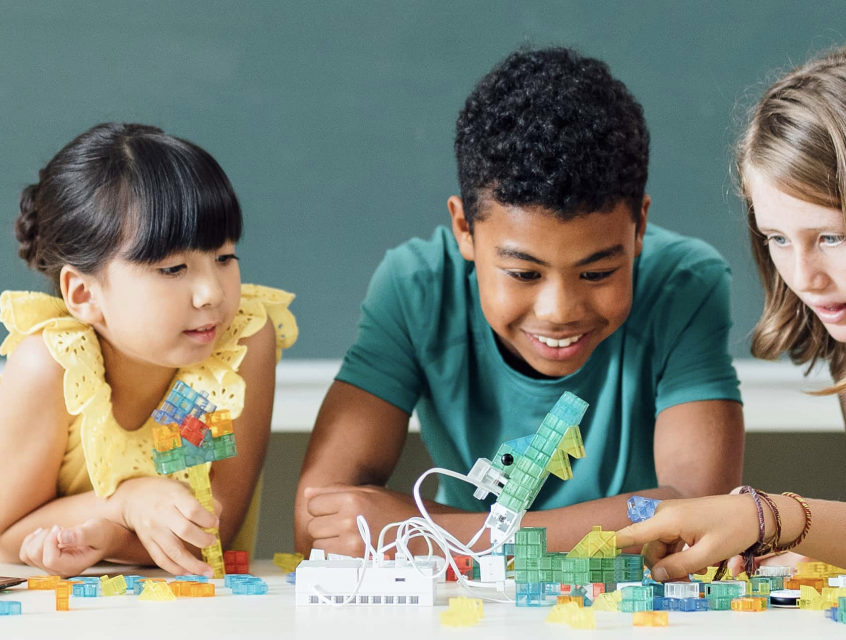 3 Students Playing with a Sony KOOV Kit