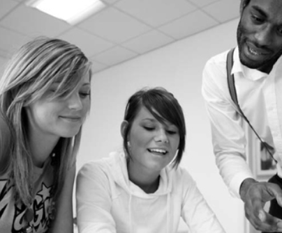 Two mentors and a mentee sitting around a table