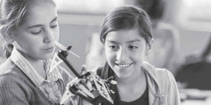 Two girls working on a science experiment