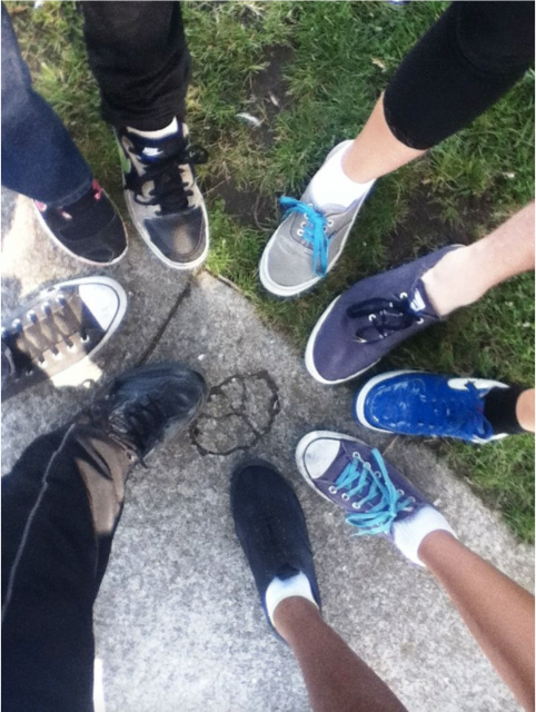 Image of shoes in a circle huddle