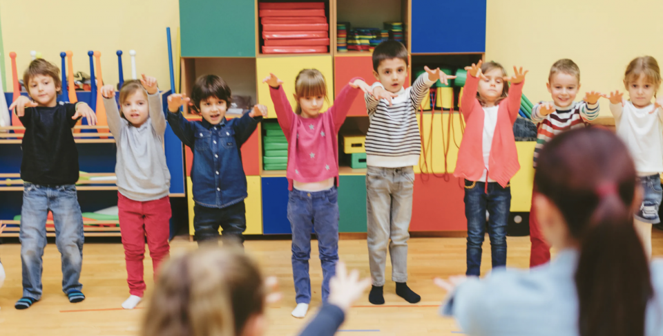 Photo of students participating in a body break activity