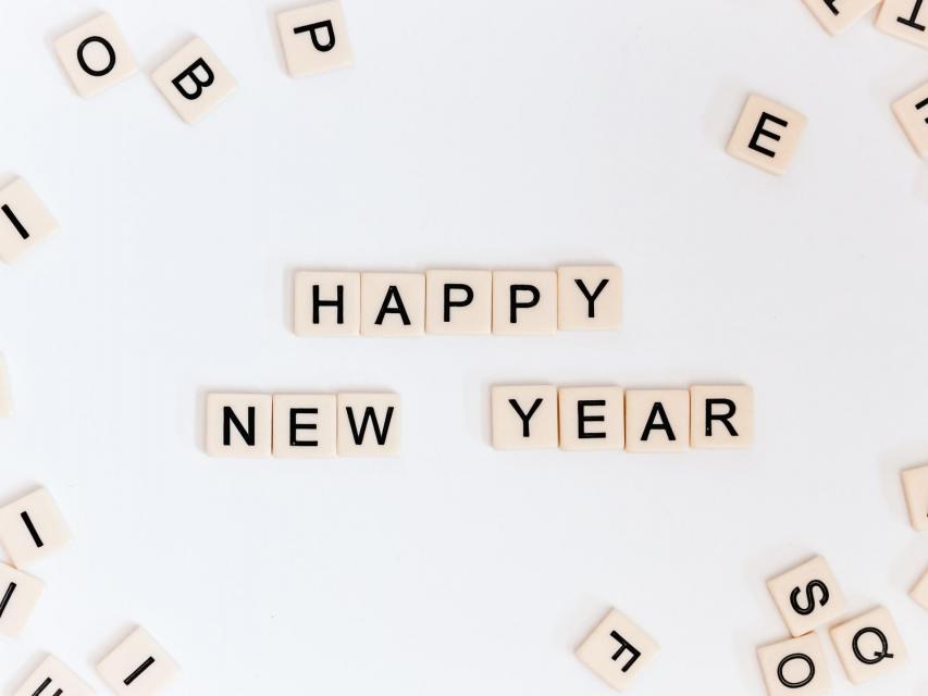 Scrabble pieces spelling out Happy New Year