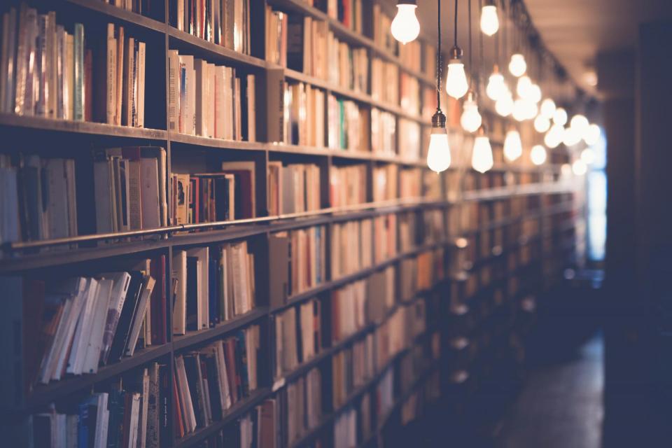 Photo of a library with hanging lights. 