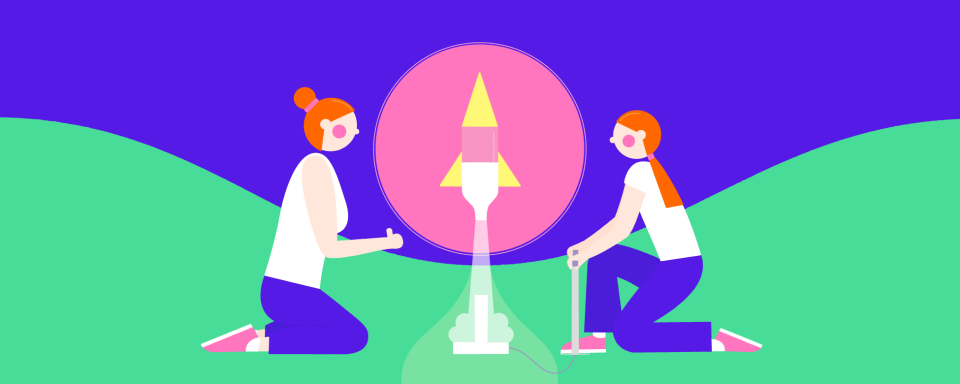 Two girls watching a rocket blast off