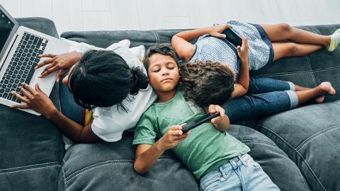Children on laptops and phones