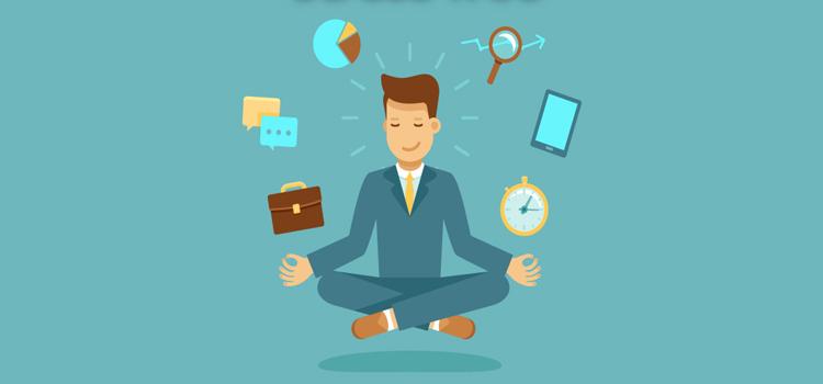 Man sitting criss-cross with objects surrounding him.