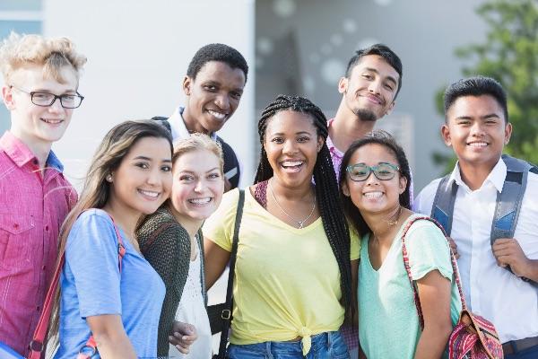 Group of students standing outside smiling