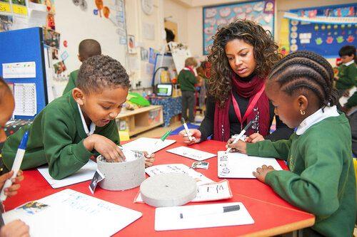 A Teacher Assisting Students 