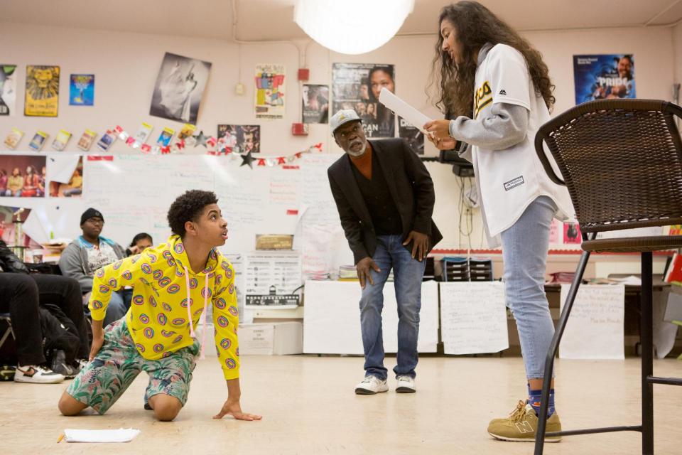 Students and Teacher in a high school theater class