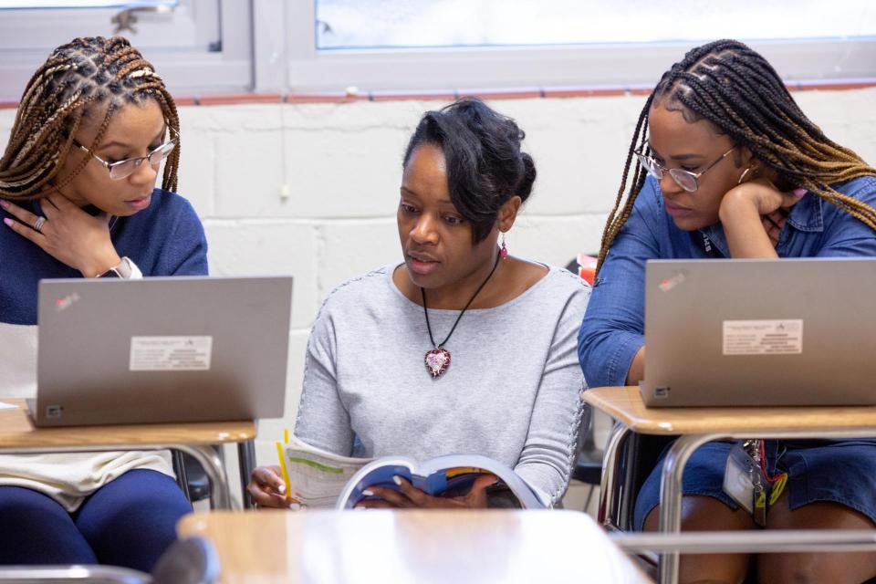 Three female math teachers collaborate