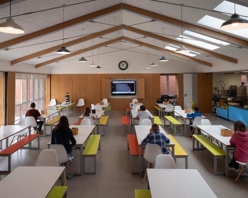 Students social distancing in cafeteria 