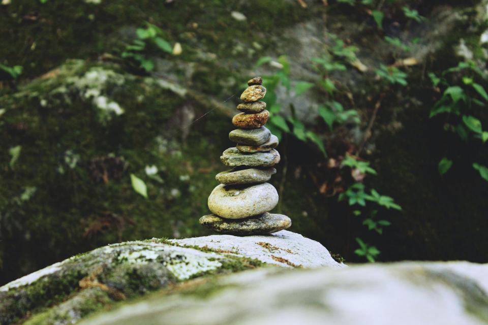 A stack of rocks by a river