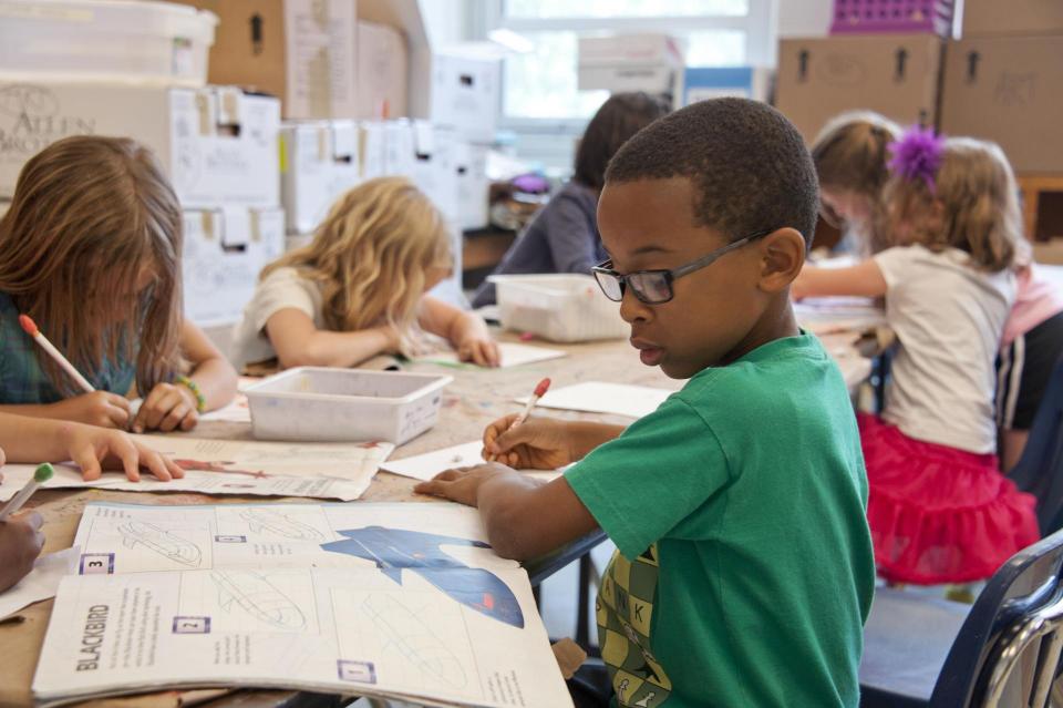 Students working on assignments in a classroom