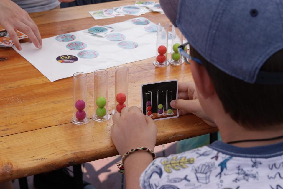 Student doing a science experiment with beakers.