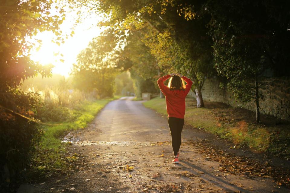 Image if young child walking with hands on head and breathing. 