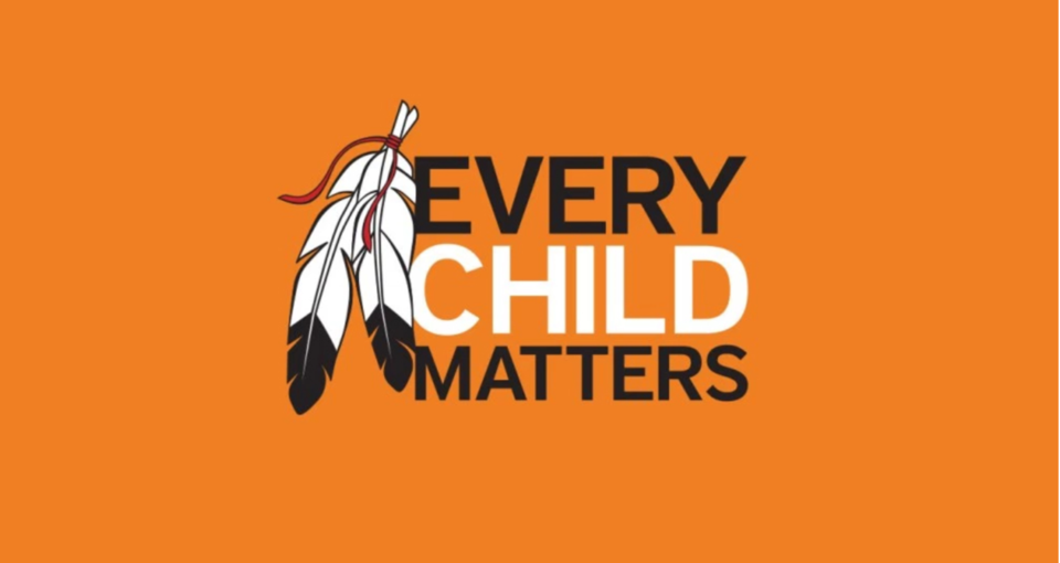 A feather and the text "every child matters" on a orange background