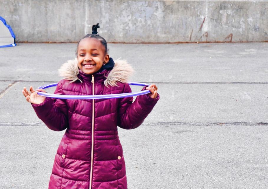 Girl holding hula hoop 