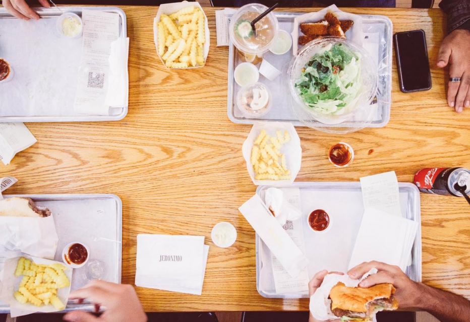 Top-down photo of four school lunches