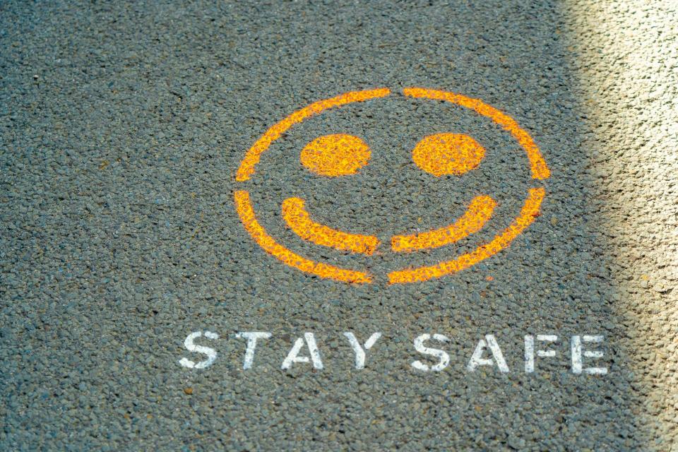 Happy face with "Stay safe" underneath