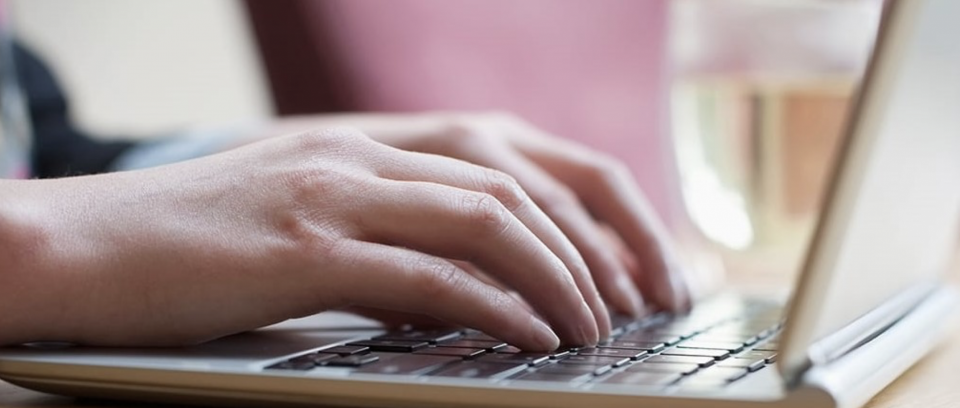 Person typing on a laptop