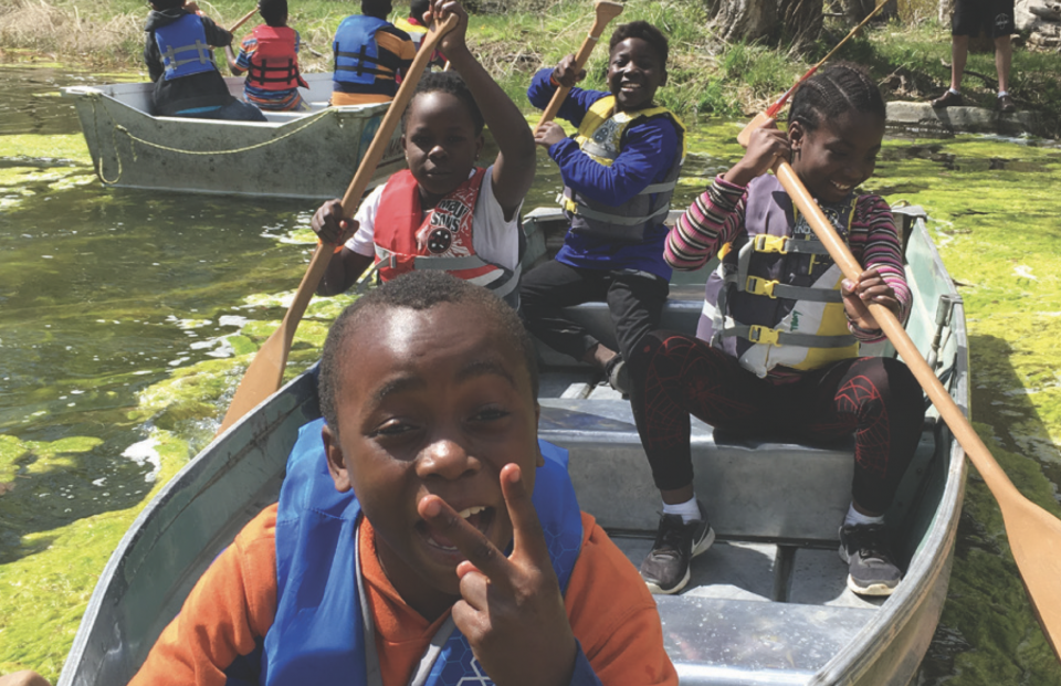 Young kids in a canoe