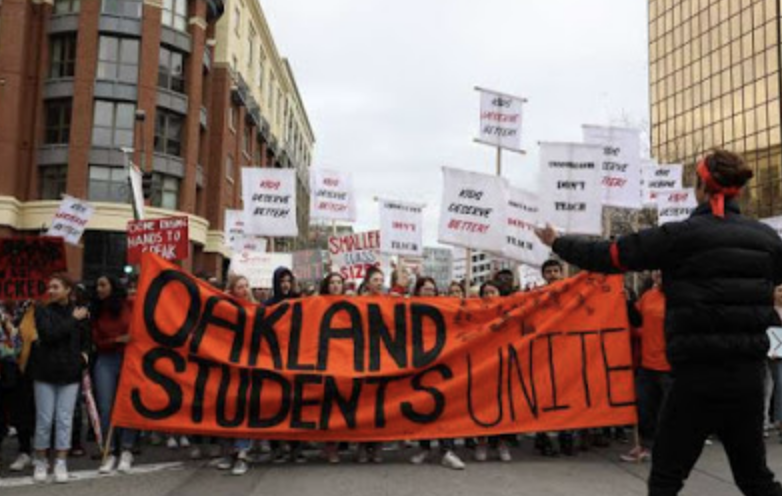 Students walking with banner