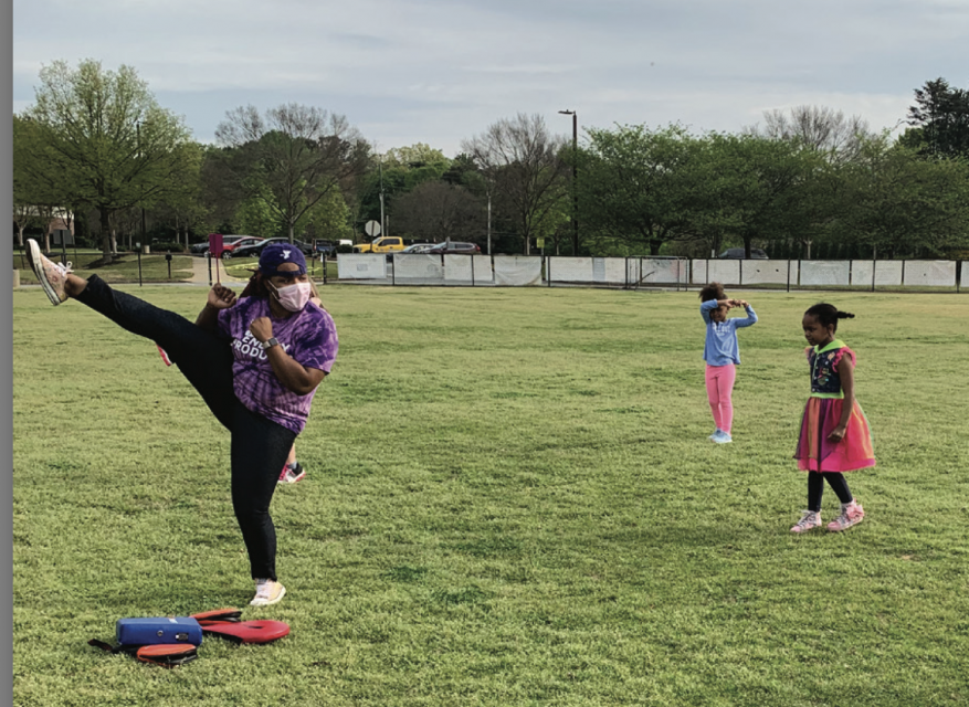 Staff and Students doing physical activity outside with masks and social distancing
