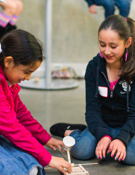 Two girls working on an experiment.