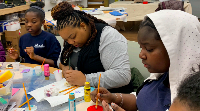 Girls in a classroom doing a project