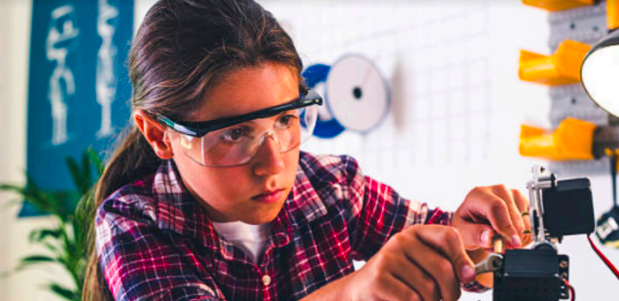 Girl working on experiment with goggles