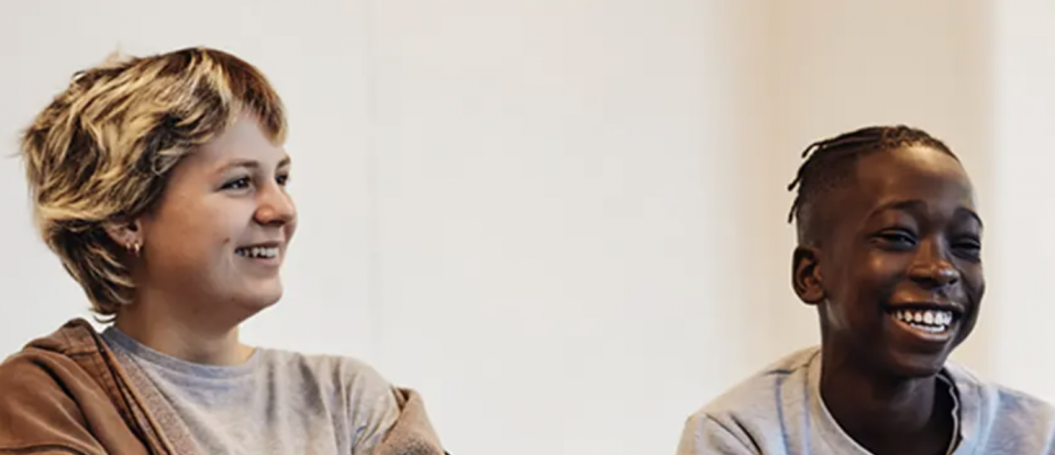 Photo of two children laughing