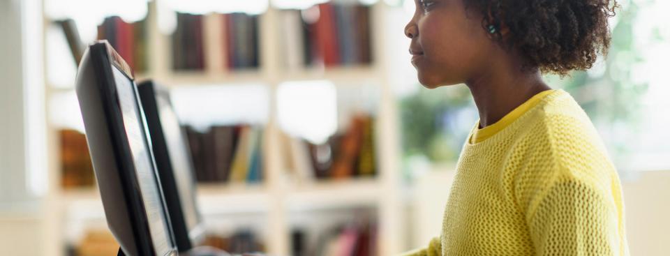 Girl looking at computer