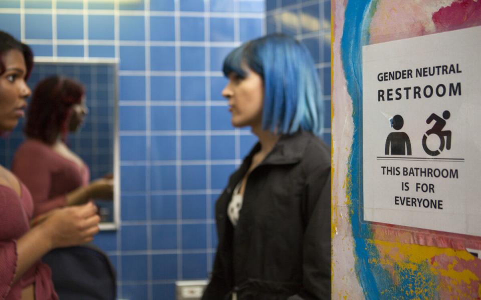 Two students in a gender neutral bathroom